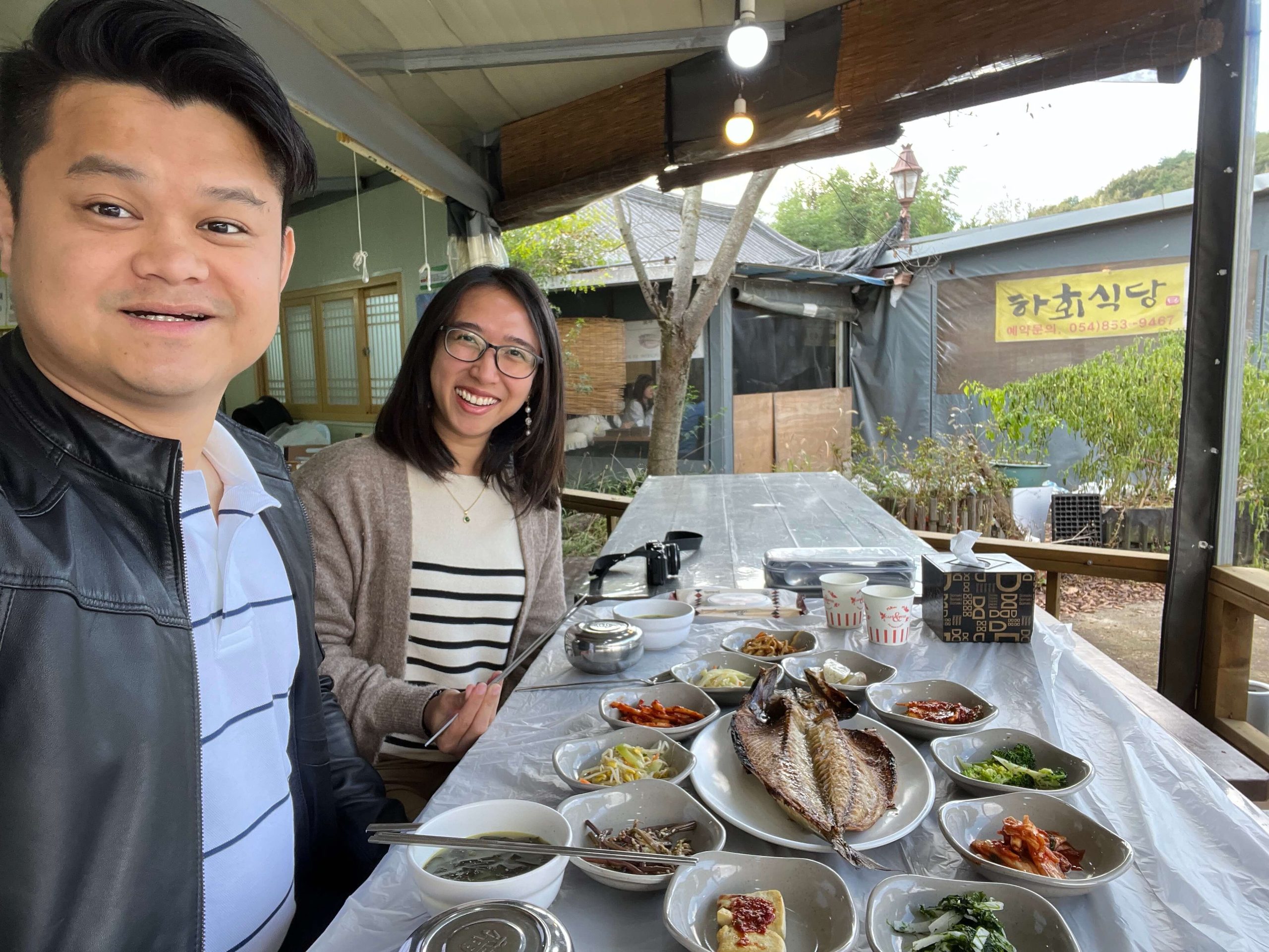 Best Day Trips from Seoul 13: A photo of us at the restaurant with the salted fish spread that won my husband over
