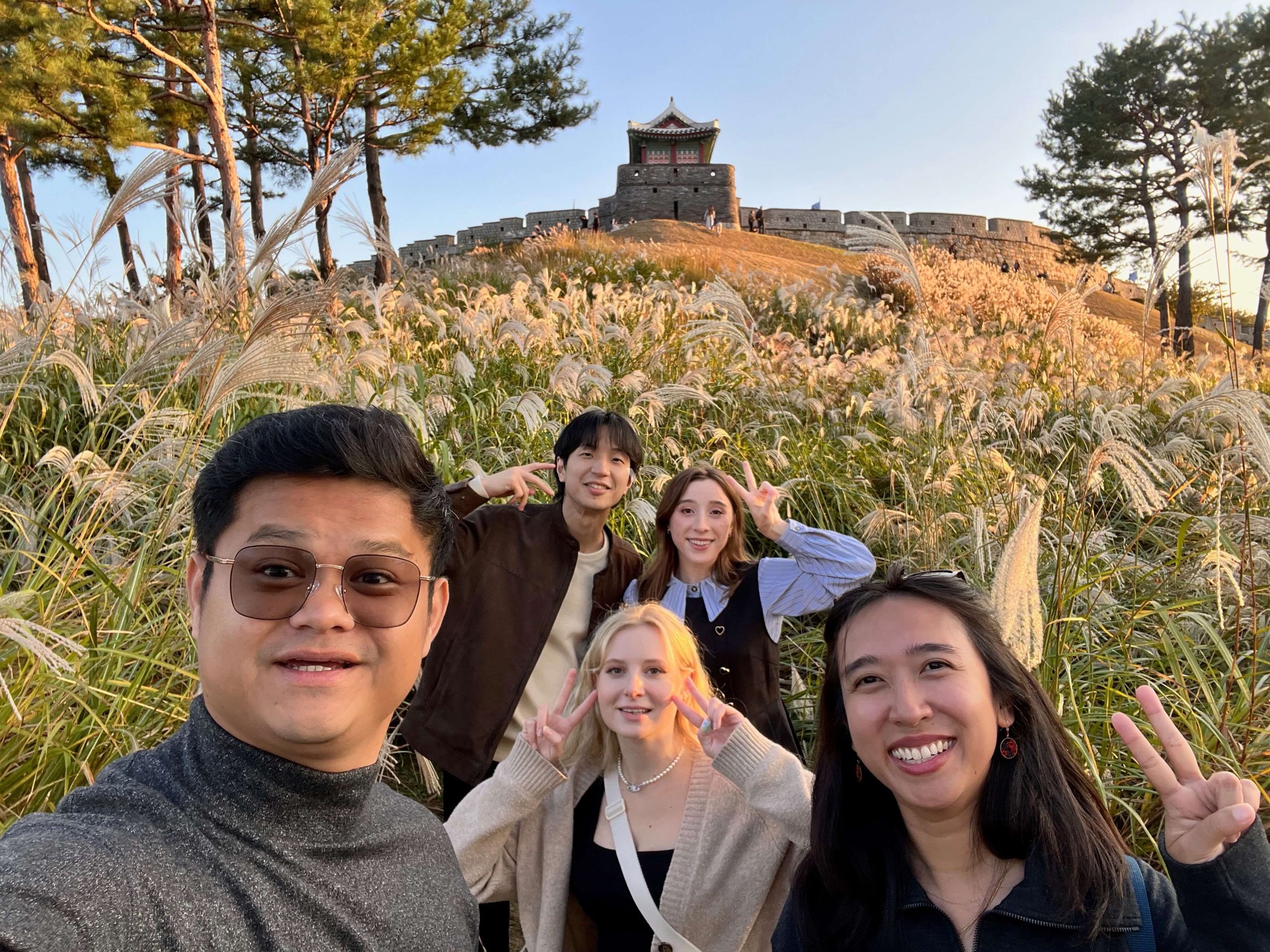 Best Day Trips from Seoul 7: A photo of us and friends at the bottom of Hwaseong Fortress